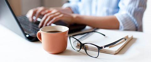 Hands typing on keyboard | CNA