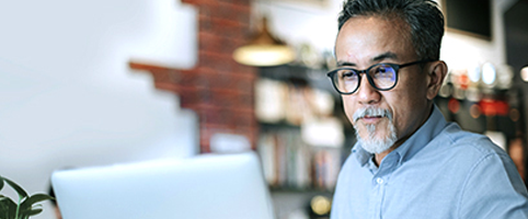 Remote learning man on computer.