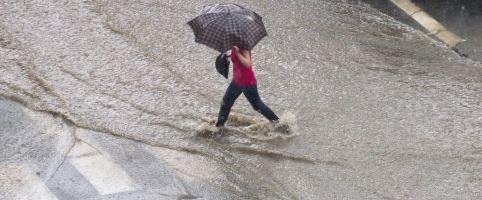 Person walking in the rain with an umbrella