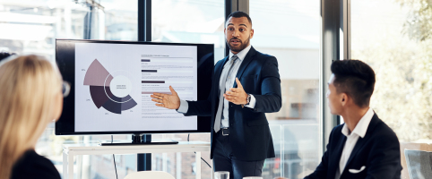 Businessman presenting in a meeting with a graph