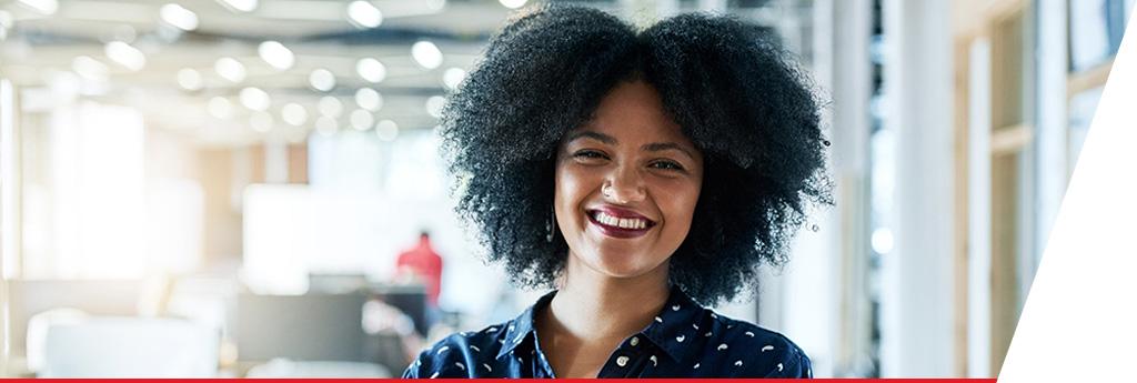 Successful female employee with arms crossed | CNA Insurance