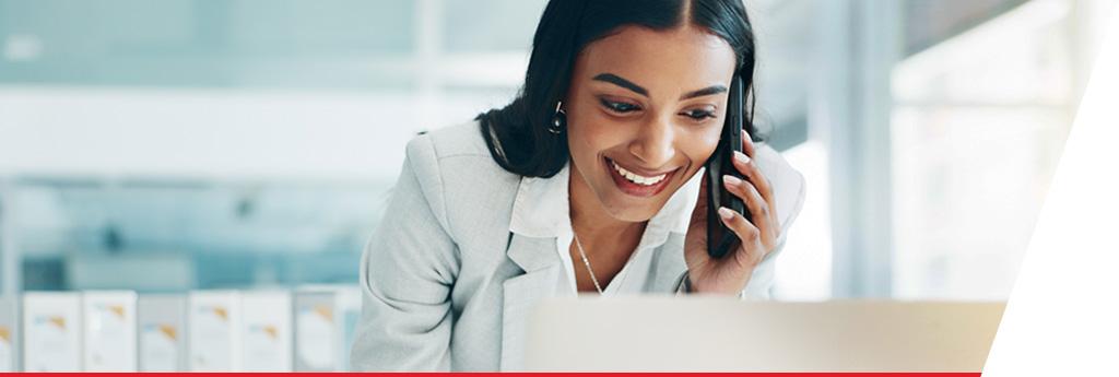 Woman on phone in office | CNA Insurance