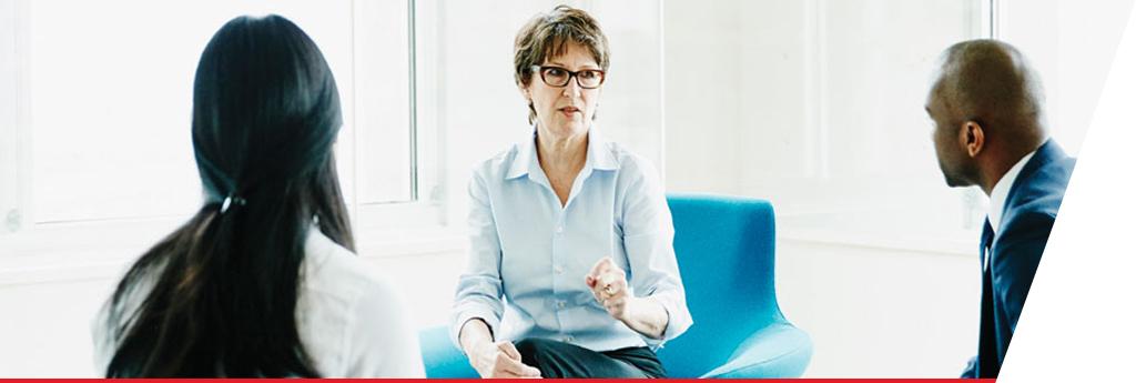 Group of professionals in discussion in a meeting | CNA Insurance