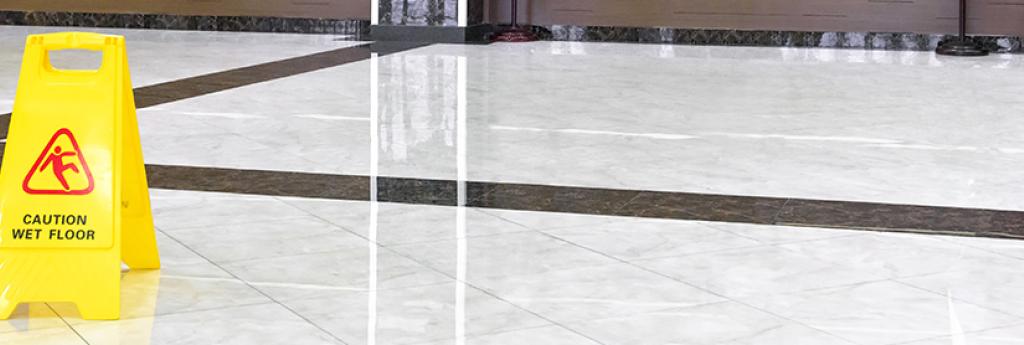 Caution sign on tile floor | CNA Canada