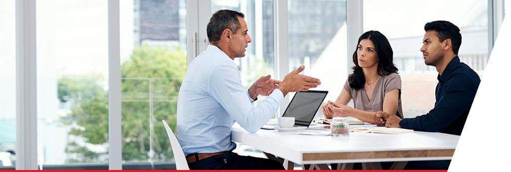 Group collaborating around table | CNA Insurance