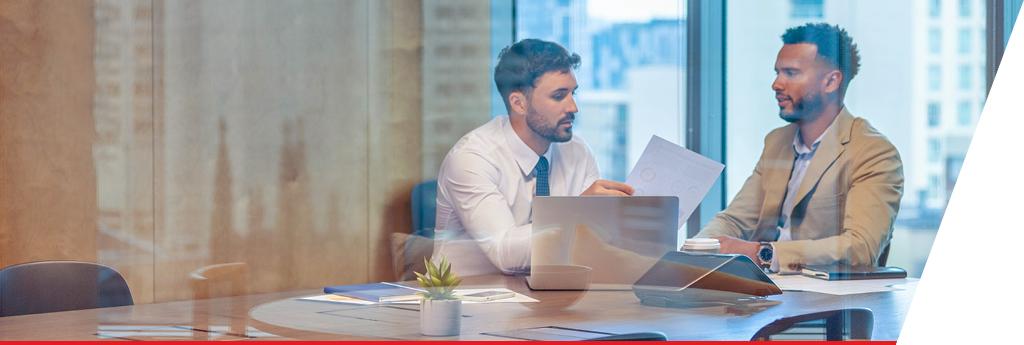 Two colleagues working together in a conference room