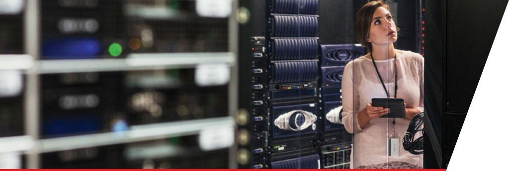 Woman working in technology server room