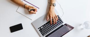 Person working and collaborating on laptop