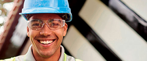 Construction worker on site smiling l CNA Insurance